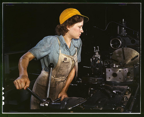 Lathe operator machining parts for transport planes at the Consolidated Aircraft Corporation plant, Fort Worth, Texas, 1942